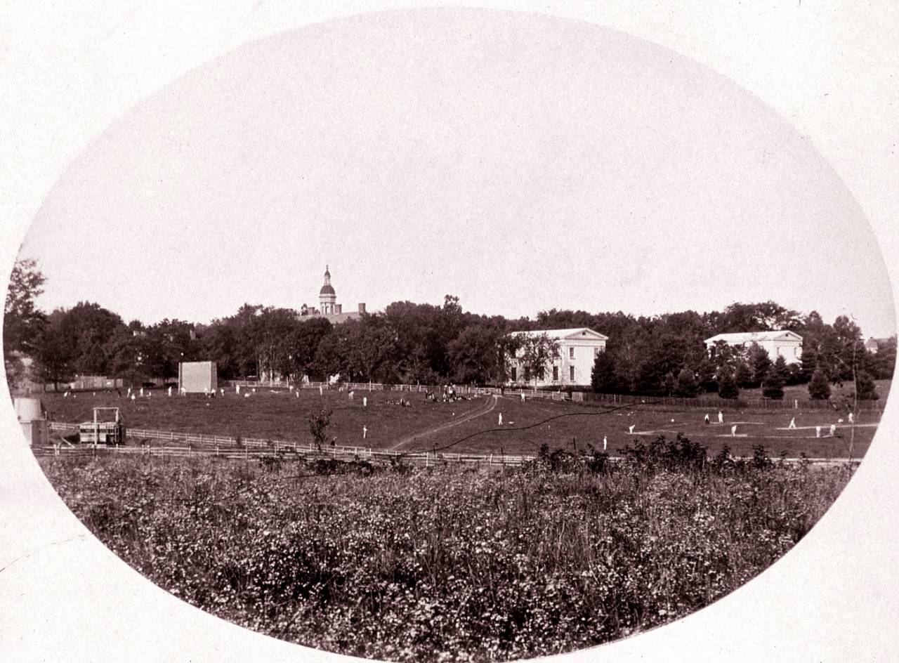 Cricket and baseball practice goes on side by side on a field in Princeton, 1861