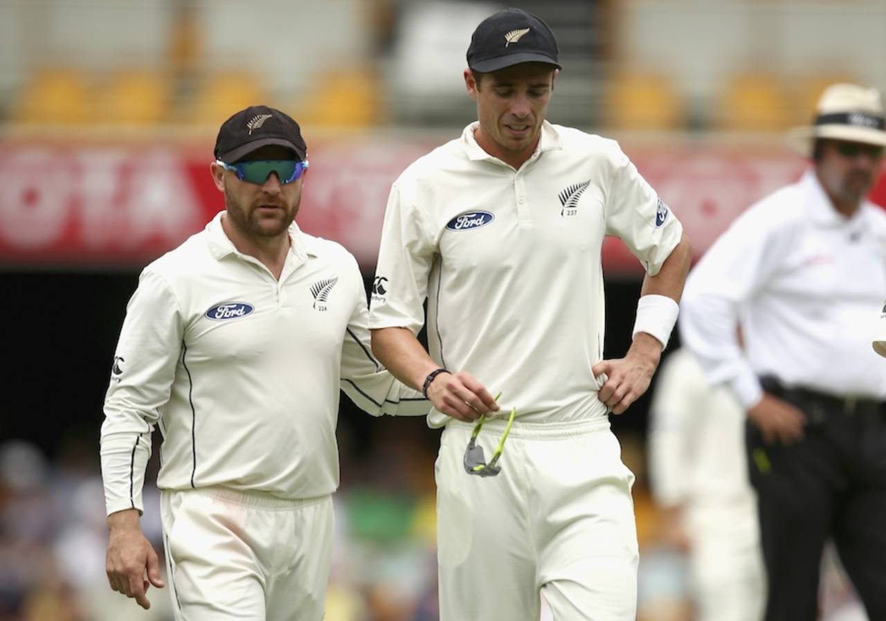 Tim Southee clutches his back alongside captain Brendon McCullum, Australia v New Zealand, 1st Test, Brisbane, November 6