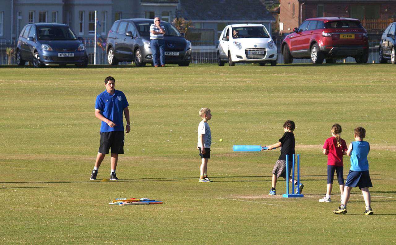 Kids play cricket in Cornwall, England, June 26, 2014
