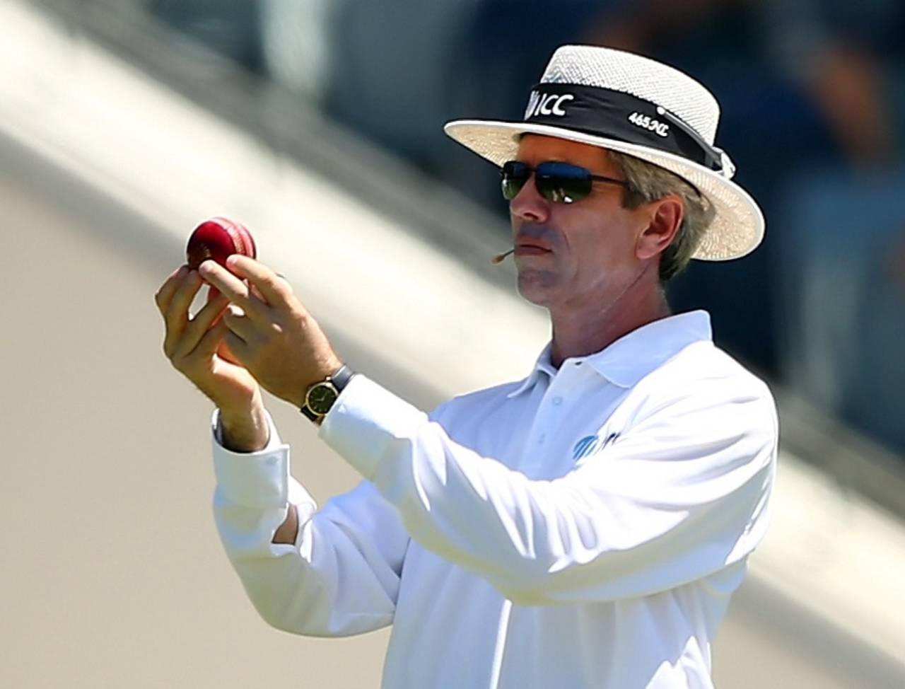 What's wrong with you: Nigel Llong inspects the ball, which had to be changed in the sixth over, Australia v New Zealand, 2nd Test, Perth, 4th day, November 16, 2015