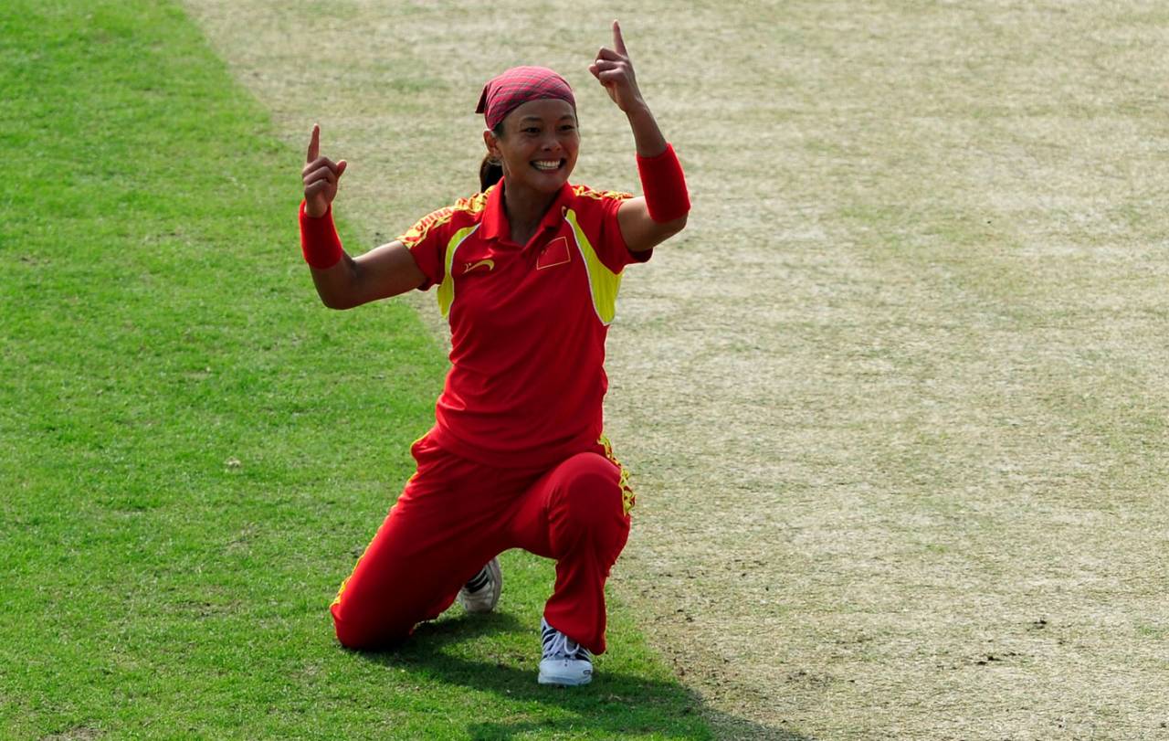 China's Mei Chun Hua celebrates a wicket, China v Japan, 3rd place play-off, Asian Games, Guangzhou, November 19, 2010 