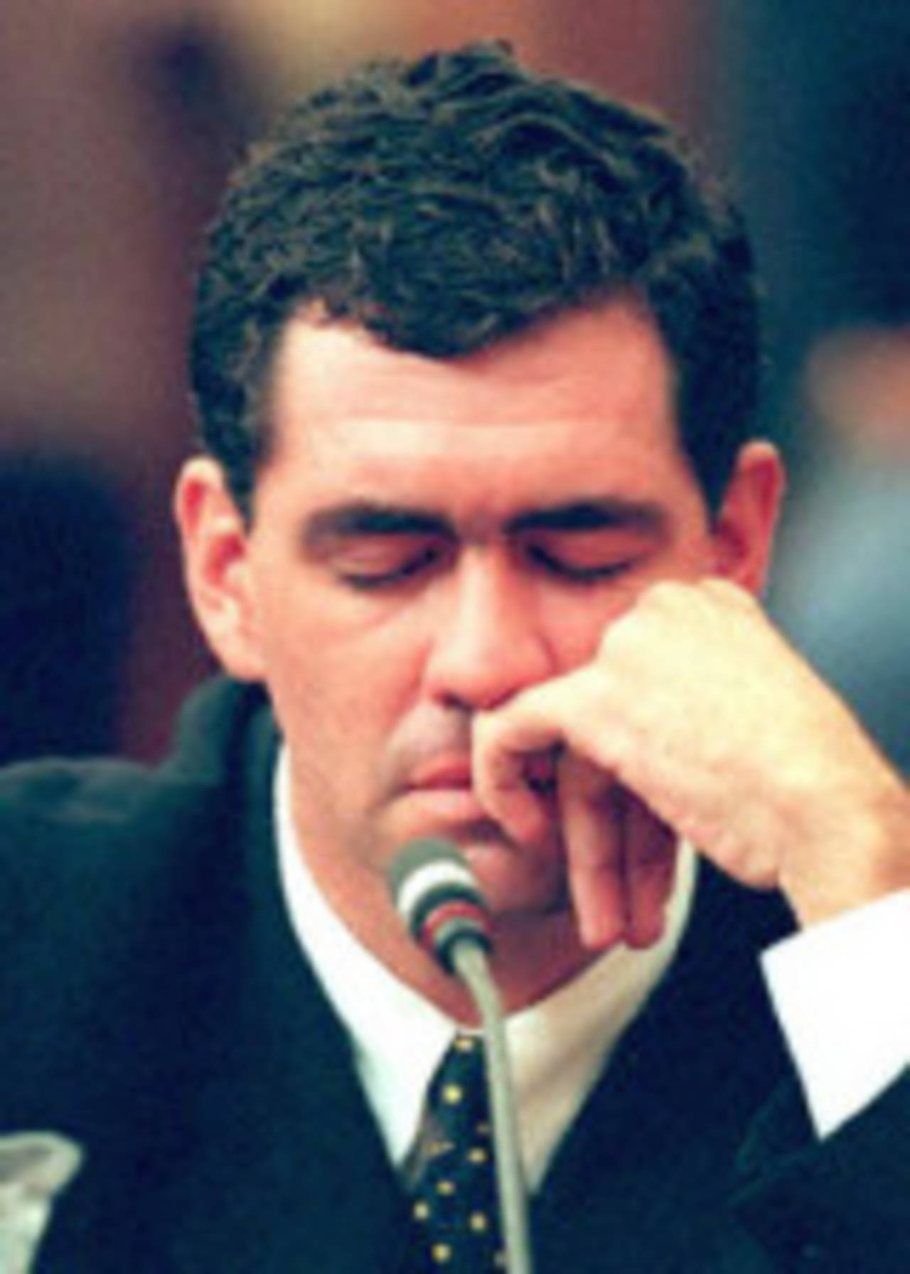 Former South African cricket captain Hansie Cronje breaks down at the end of his cross-examination before the King Commission of Inquiry into match-fixing allegations in Cape Town 23 June 2000.