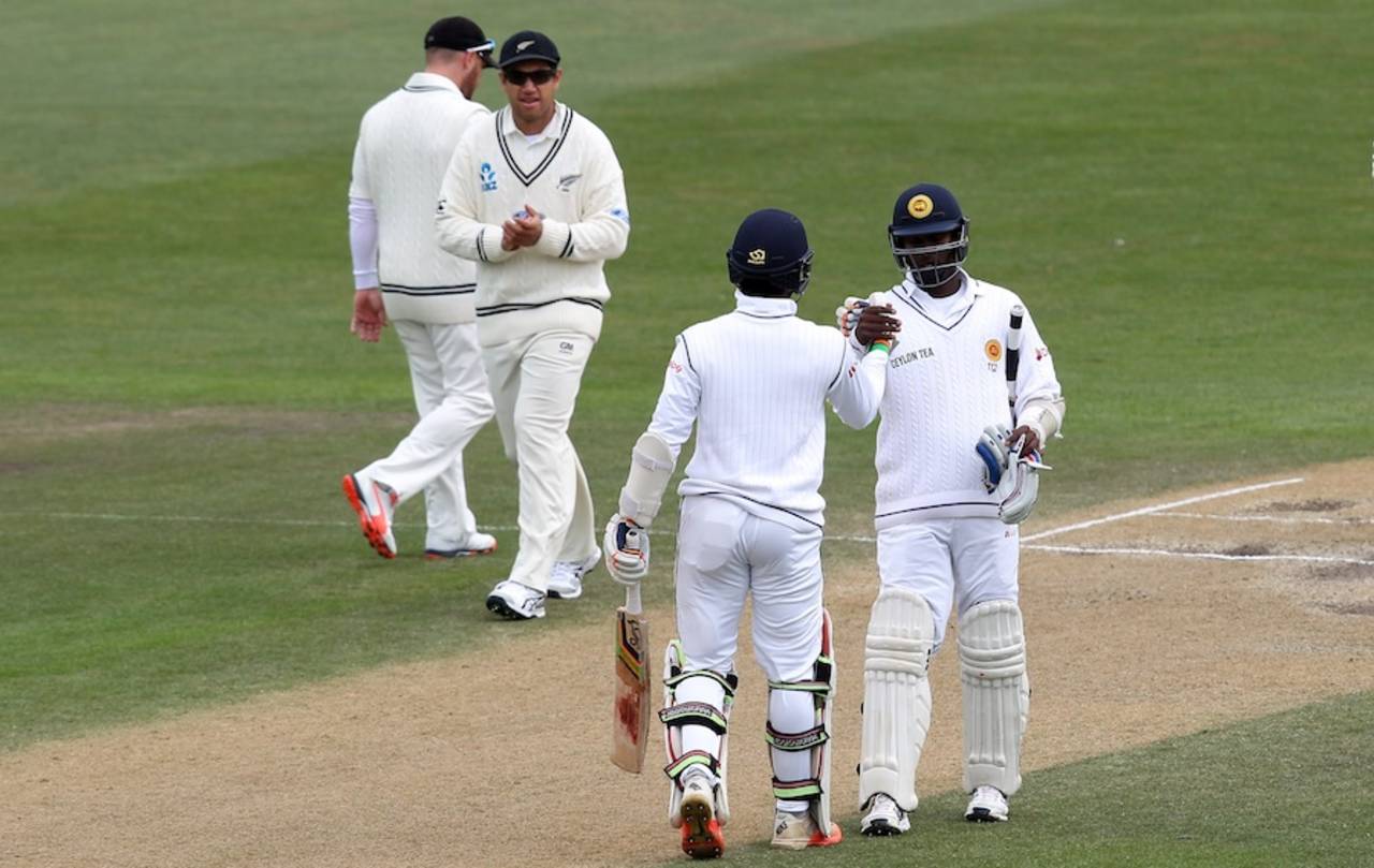 Angelo Mathews congratulates Dinesh Chandimal on his fifty, New Zealand v Sri Lanka, 1st Test, Dunedin, 5th day, December 14, 2015
