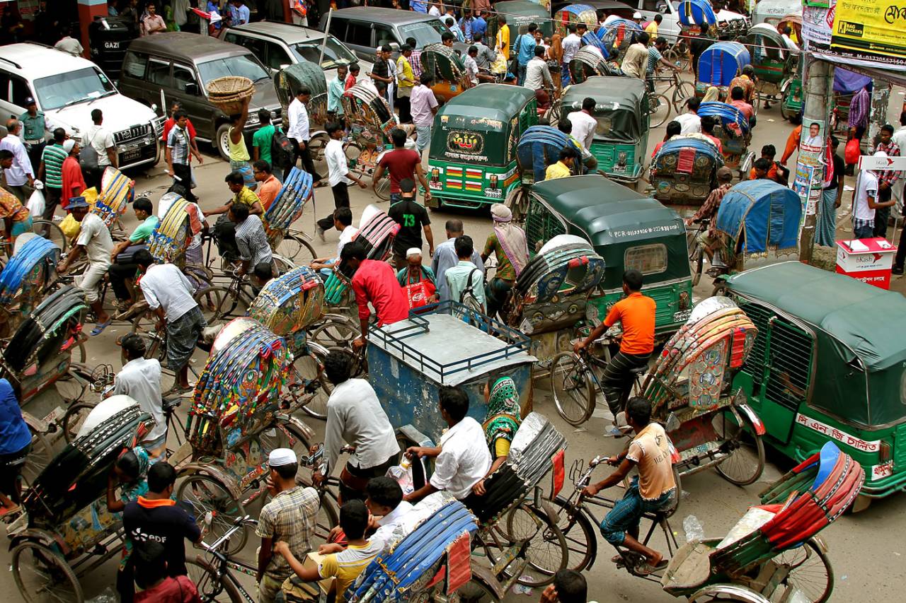 Three-wheeler traffic jams a street in Dhaka, July 15, 2012
