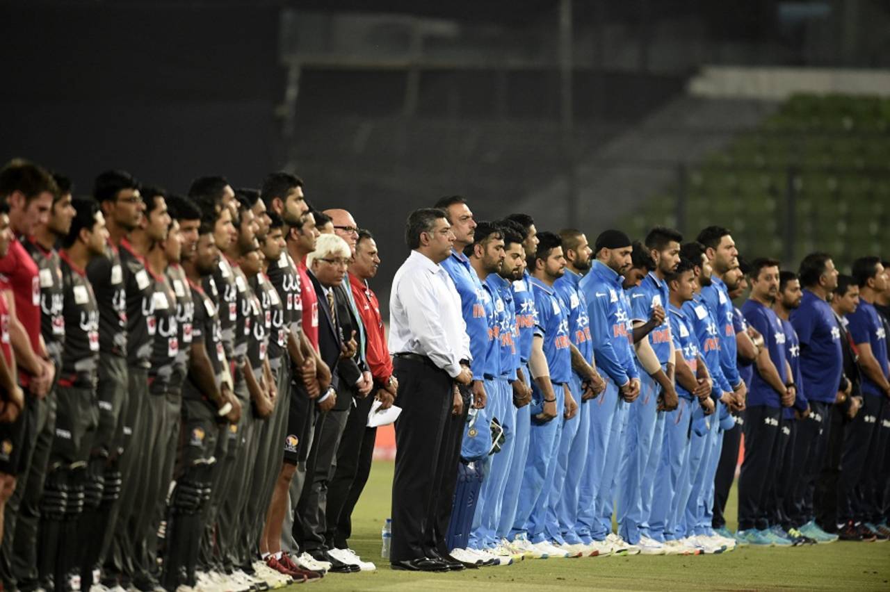 The teams, support staff, and officials observed a minute's silence in memory of Martin Crowe, after UAE chose to bat on a greenish track&nbsp;&nbsp;&bull;&nbsp;&nbsp;AFP