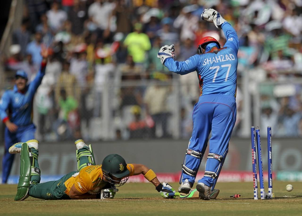 Mohammad Shahzad appeals after Faf du Plessis is caught short of his crease, Afghanistan v South Africa, World T20 2016, Group1, Mumbai, March 20,2016