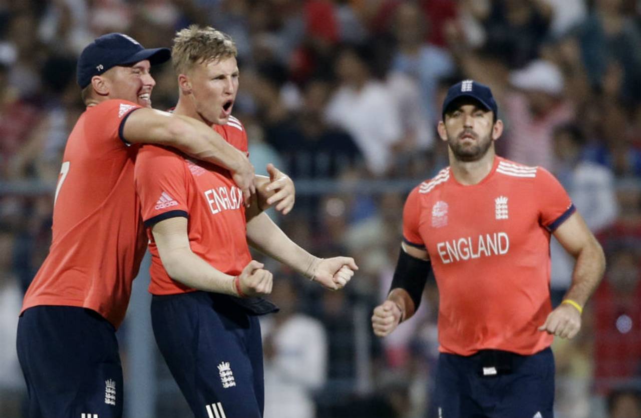 Joe Root is congratulated by Eoin Morgan after dismissing Johnson Charles in the second over, England v West Indies, World T20, final, Kolkata, April 3, 2016 