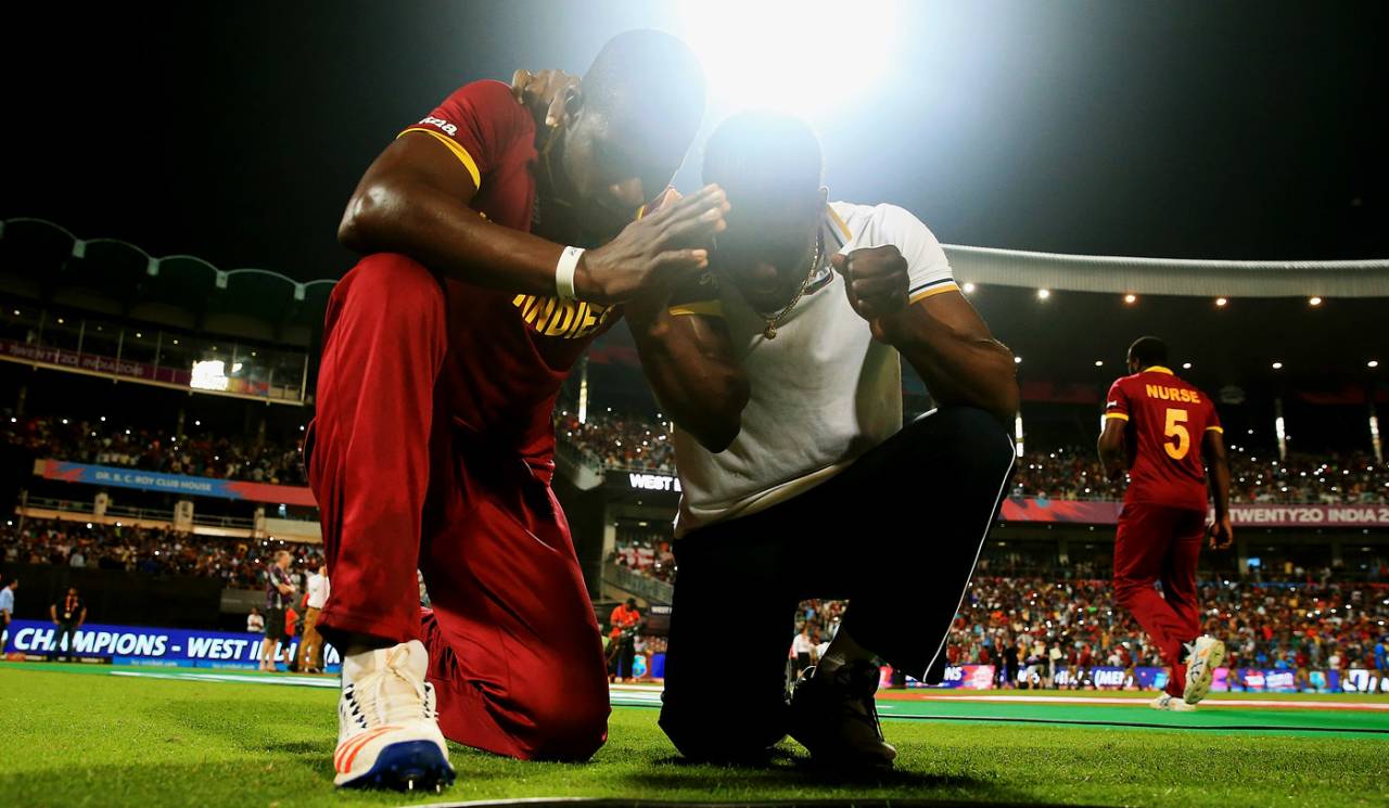 We pray and we play: Darren Sammy and Andre Fletcher thank the Almighty after the win&nbsp;&nbsp;&bull;&nbsp;&nbsp;AFP