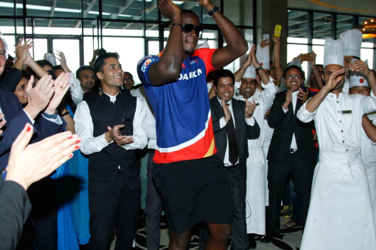 Carlos Brathwaite gets a champion's welcome at a hotel in Delhi, April 5, 2016