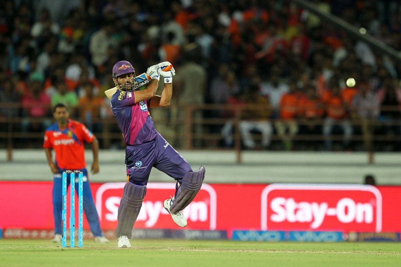 MS Dhoni drives during his unbeaten 22, Gujarat Lions v Rising Pune Supergiants, IPL 2016, Rajkot, April 14, 2016