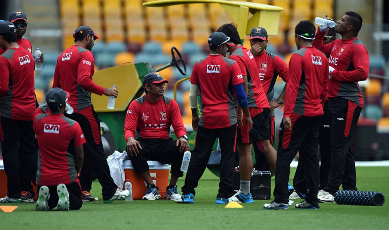 Aaqib Javed (centre, seated) was coach of the UAE side for four years before he stepped down in April&nbsp;&nbsp;&bull;&nbsp;&nbsp;AFP