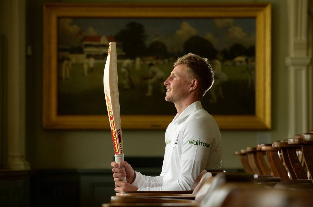 Joe Root poses with his bat in the Lord's Long Room, June 2016