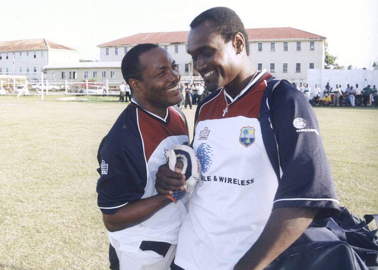 Brian Lara and Carl Hooper share a light moment at training in Guyana, Georgetown, April 9, 2002