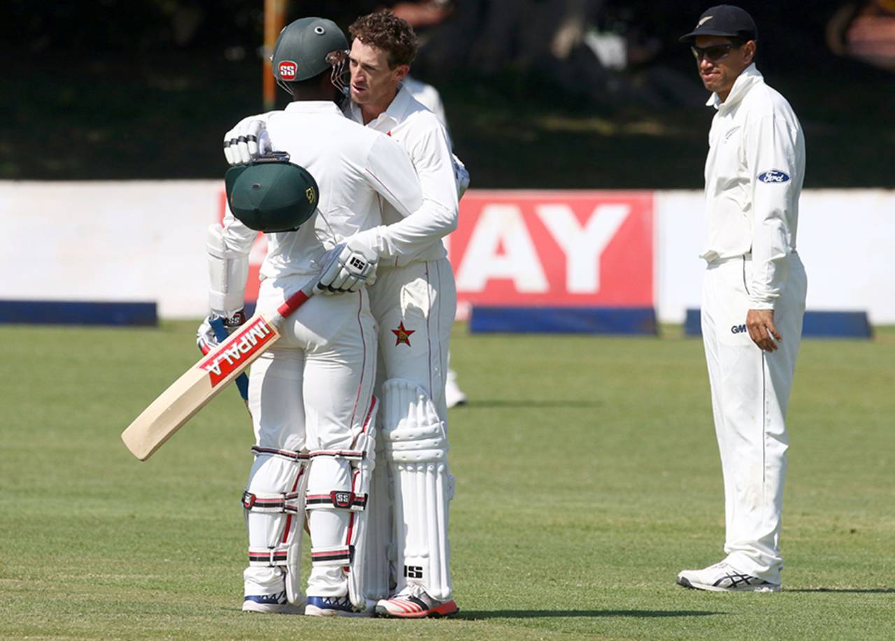 Regis Chakabva embraces Sean Williams after the latter's maiden Test century, Zimbabwe v New Zealand, 1st Test, Bulawayo, 4th day, July 31, 2016
