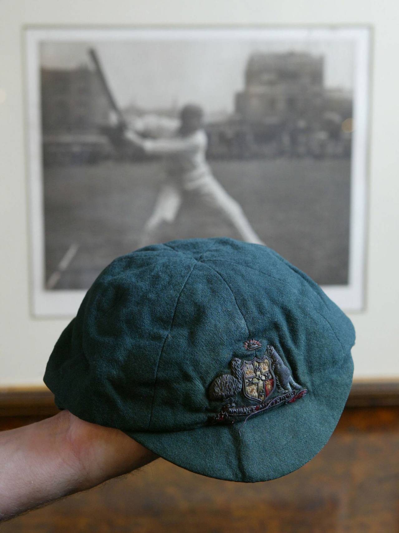 The cap that fascinates: Trumper's headgear at auction in 2004, with Beldam's image in the background&nbsp;&nbsp;&bull;&nbsp;&nbsp;Getty Images