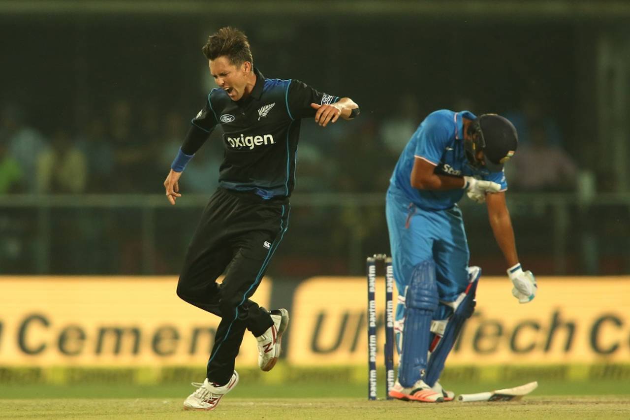 Trent Boult exults after dismissing Rohit Sharma, while the batsman is hunched over and is cramping up&nbsp;&nbsp;&bull;&nbsp;&nbsp;BCCI