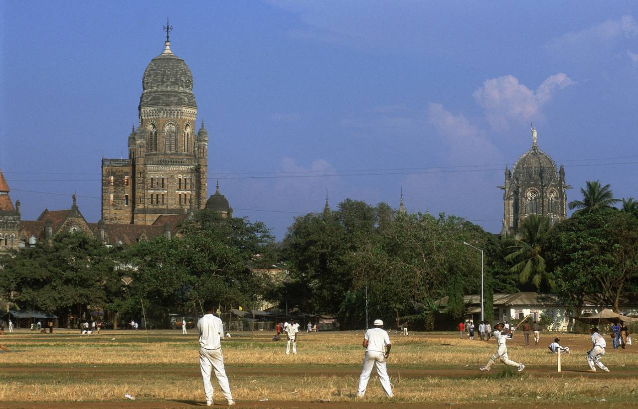 Kids play cricket in a maidan in Mumbai, November 2001
