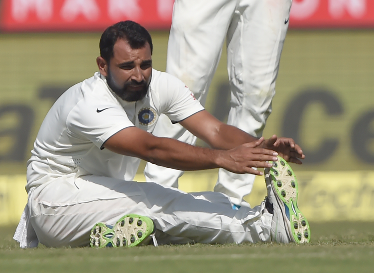 Mohammed Shami stretches after pulling his hamstring while bowling, India v England, 1st Test, Rajkot, 1st day, November 9, 2016