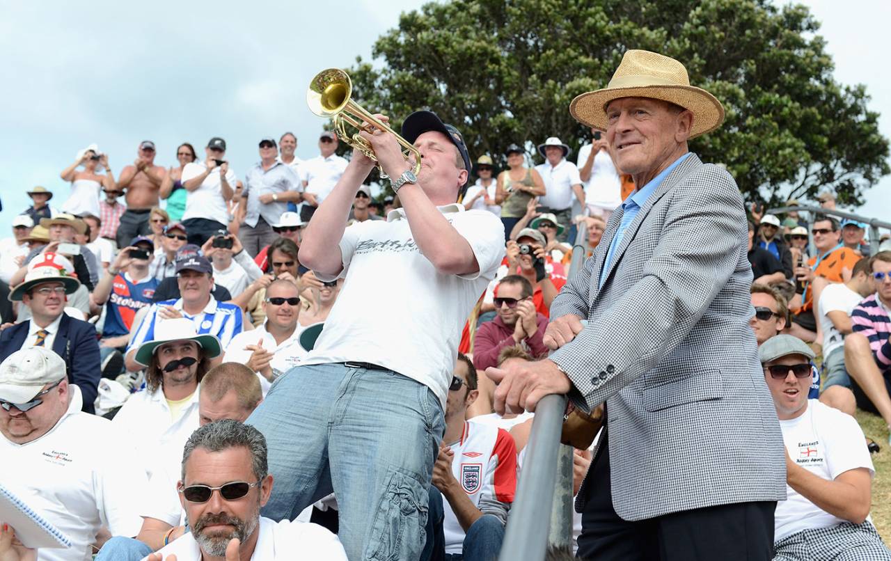 Barmy Army trumpeter Billy Cooper entertains spectators and Geoff Boycott, New Zealand v England, 2nd Test, Wellington, 2nd day, March 15, 2013