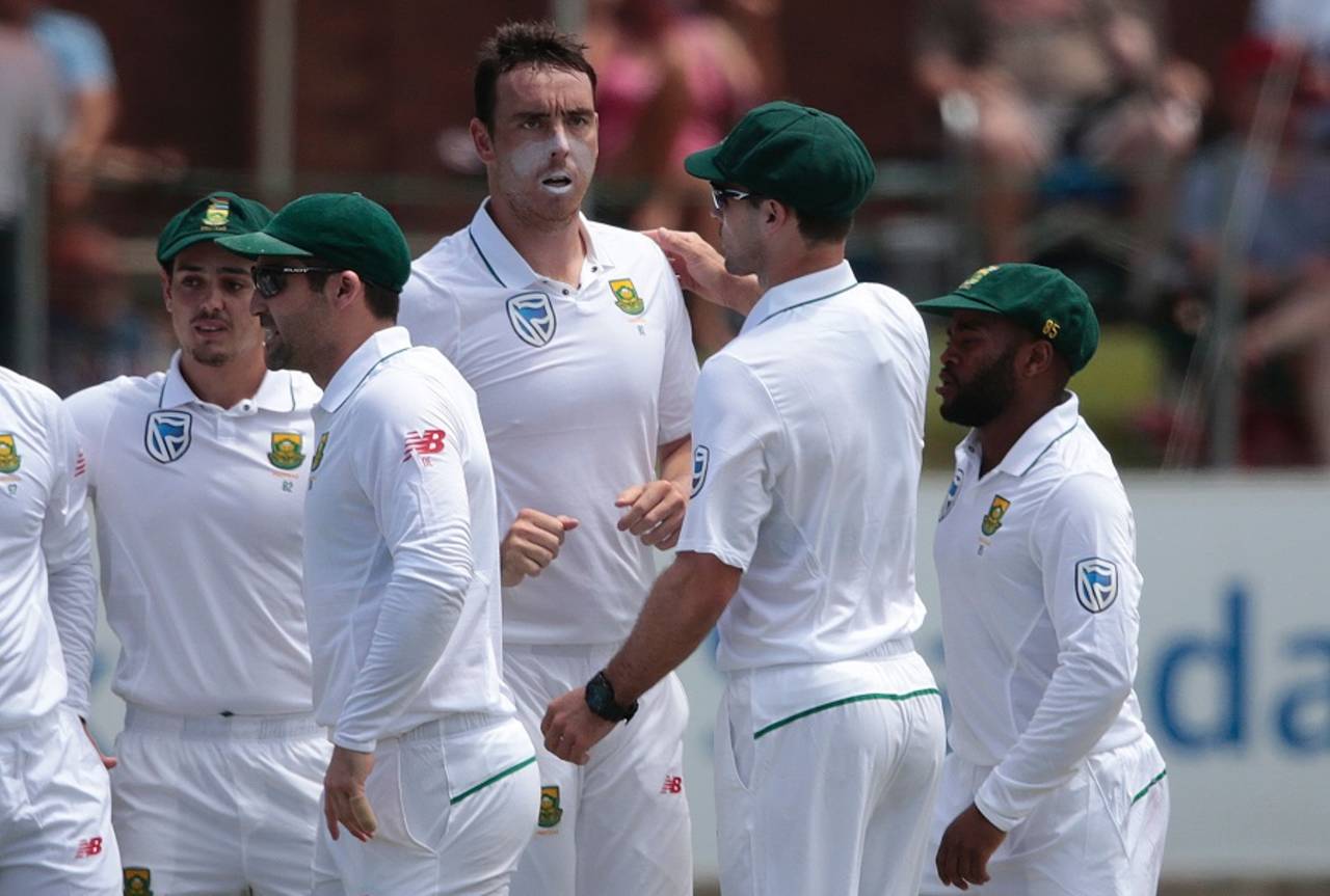 Kyle Abbott is mobbed by team-mates after picking up an early wicket, South Africa v Sri Lanka, 1st Test, Port Elizabeth, 2nd day, December 27, 2016