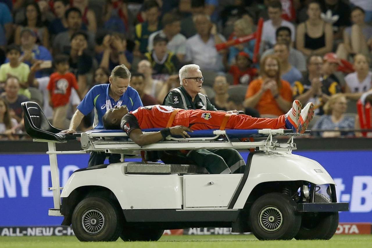 Dwayne Bravo was stretchered off the field after jarring his foot near the boundary during the BBL&nbsp;&nbsp;&bull;&nbsp;&nbsp;Cricket Australia/Getty Images