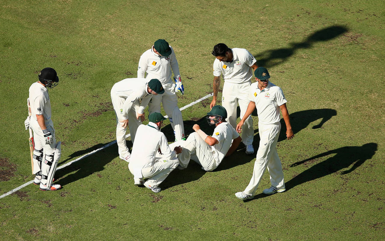 Joe Burns takes a breather after being hit on the helmet while fielding, Australia v New Zealand, 2nd Test, Perth, 2nd day, November 14, 2015