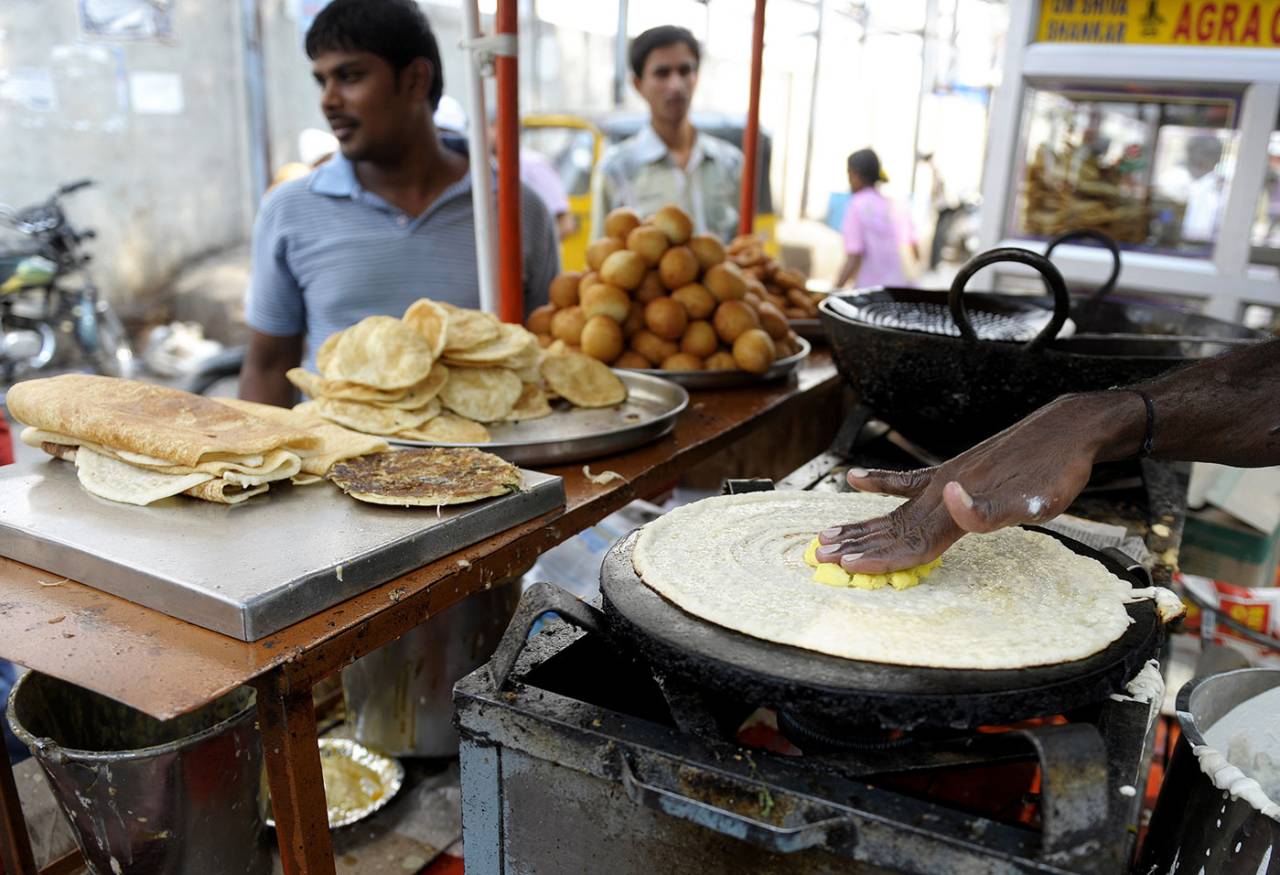 A street vendor makes masala dosa, Hyderabad, June 3, 2013