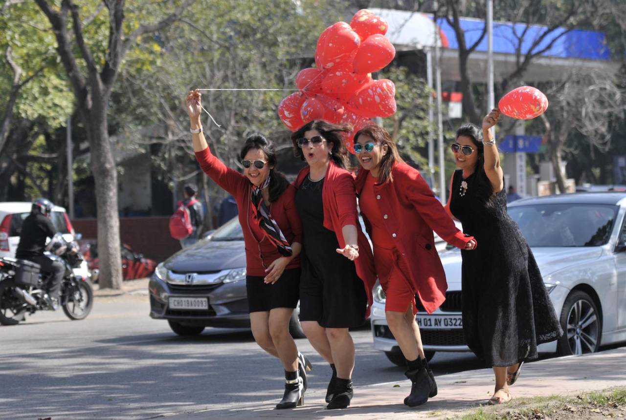 Girls enjoying Valentine's Day with red balloons in Chandigarh sector 10 on February 14, 2017 