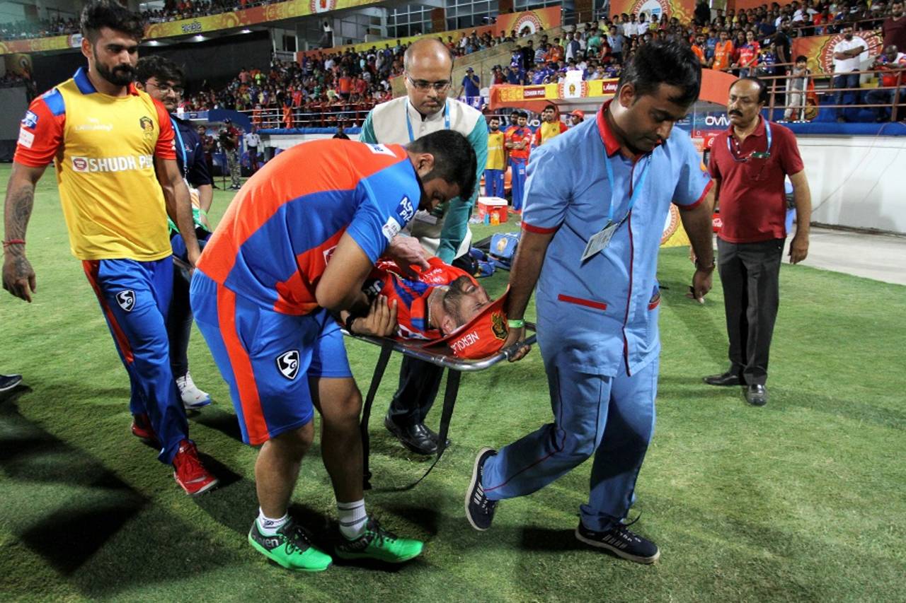 Andrew Tye is stretchered off after injuring his shoulder, Gujarat Lions v Mumbai Indians, IPL, Rajkot, April 29, 2017