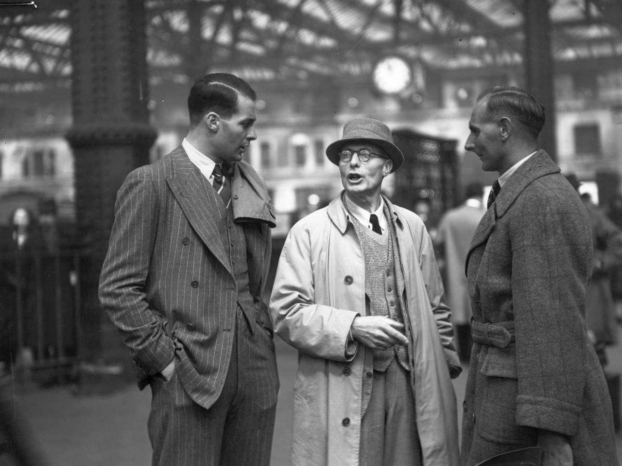 Ken Farnes (left) and Hedley Verity (right) are greeted by Farnes' father on their return to England at the end of the 1939 tour of South Africa, Waterloo Station, London, March 31,  1939