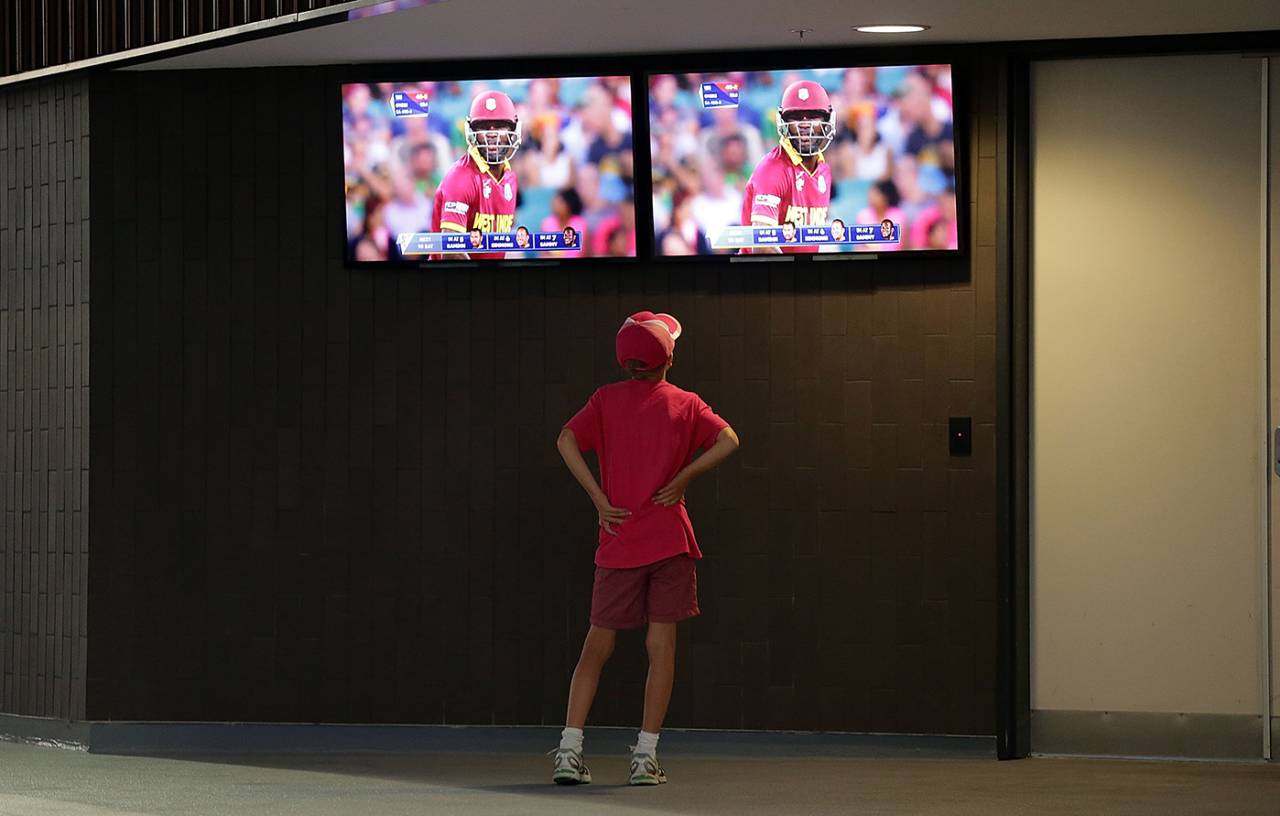 A young fan watches the South Africa-West Indies World Cup game on TV, Sydney, February 27, 2015
