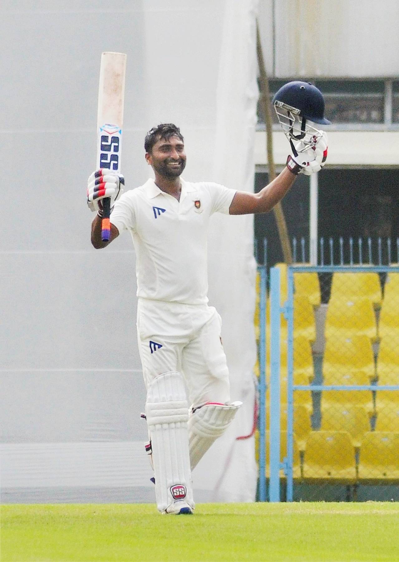Arindam Ghosh raises his bat after getting a hundred&nbsp;&nbsp;&bull;&nbsp;&nbsp;PTI 