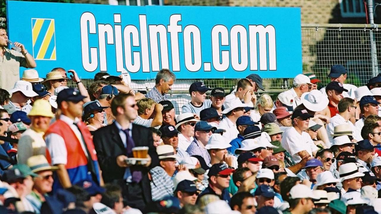 Fans watch the match against the background of a Cricinfo advert , England v Australia, 5th npower Ashes Test, day one, The Oval , August 23, 2001