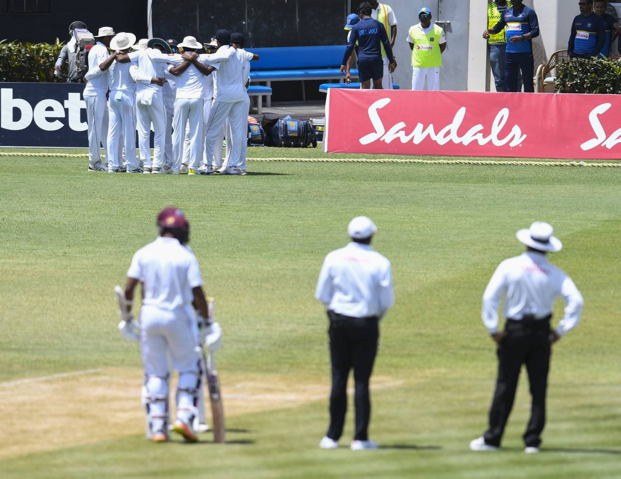 The umpires and batsmen wait on the Sri Lanka players, West Indies v Sri Lanka, 2nd Test, Gros Islet, 3rd day, June 16, 2018
