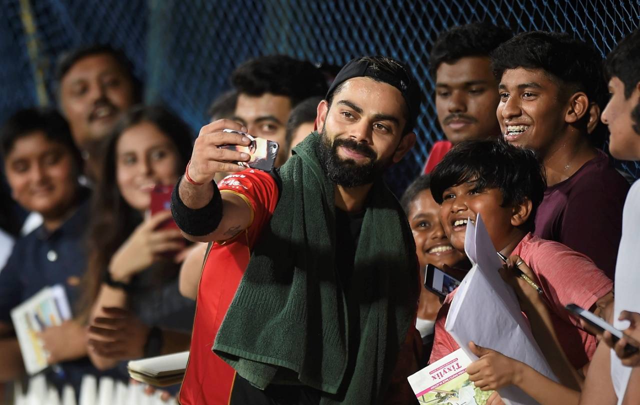 Virat Kohli with his fans during an RCB training session in Chennai ahead of the IPL 2019 opener