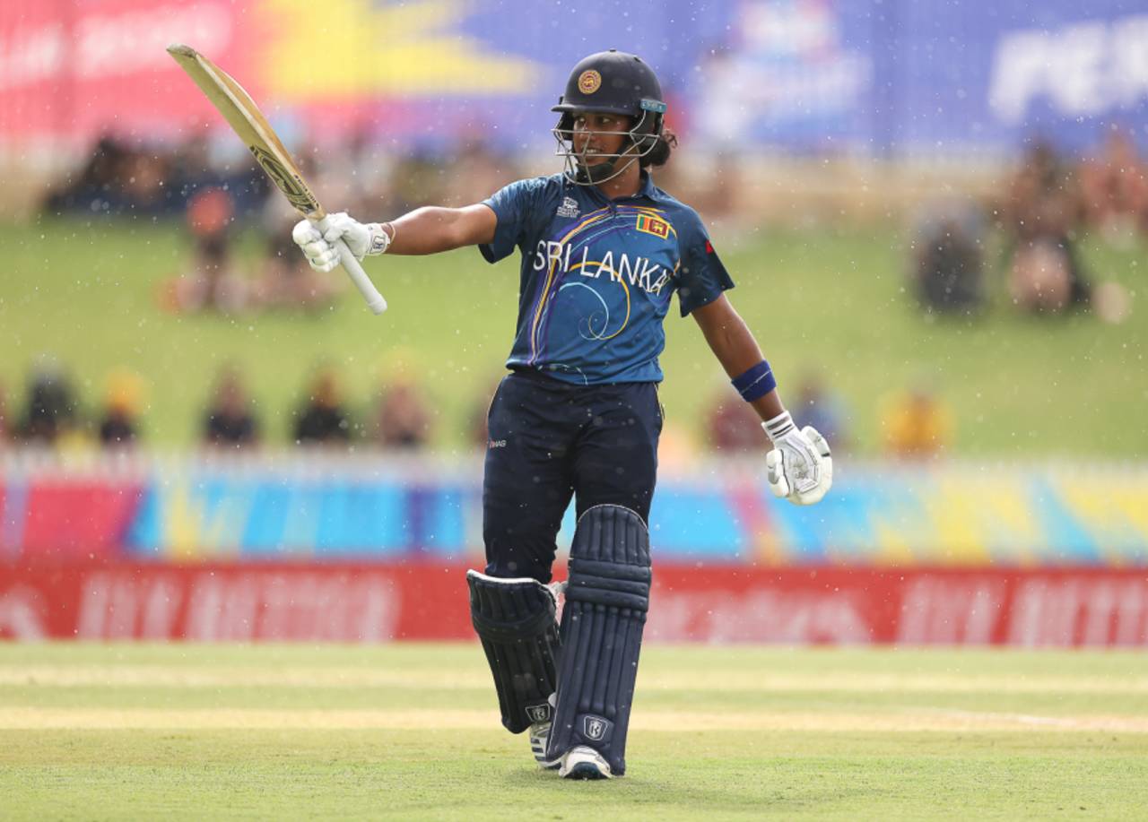 Chamari Atapattu raises her bat through the drizzle after reaching 50 off 37 balls, Australia v Sri Lanka, Women's T20 World Cup, Group A, Perth, February 24, 2020
