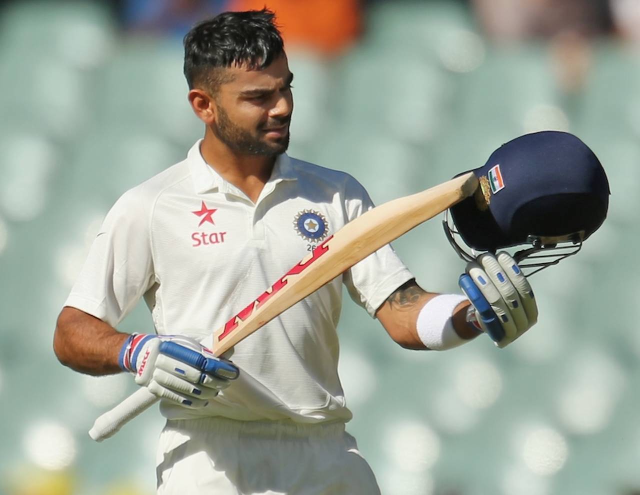 Virat Kohli points to the crest and flag on his helmet after reaching his ton, Australia v India, 1st Test, Adelaide, 3rd day, December 11, 2014