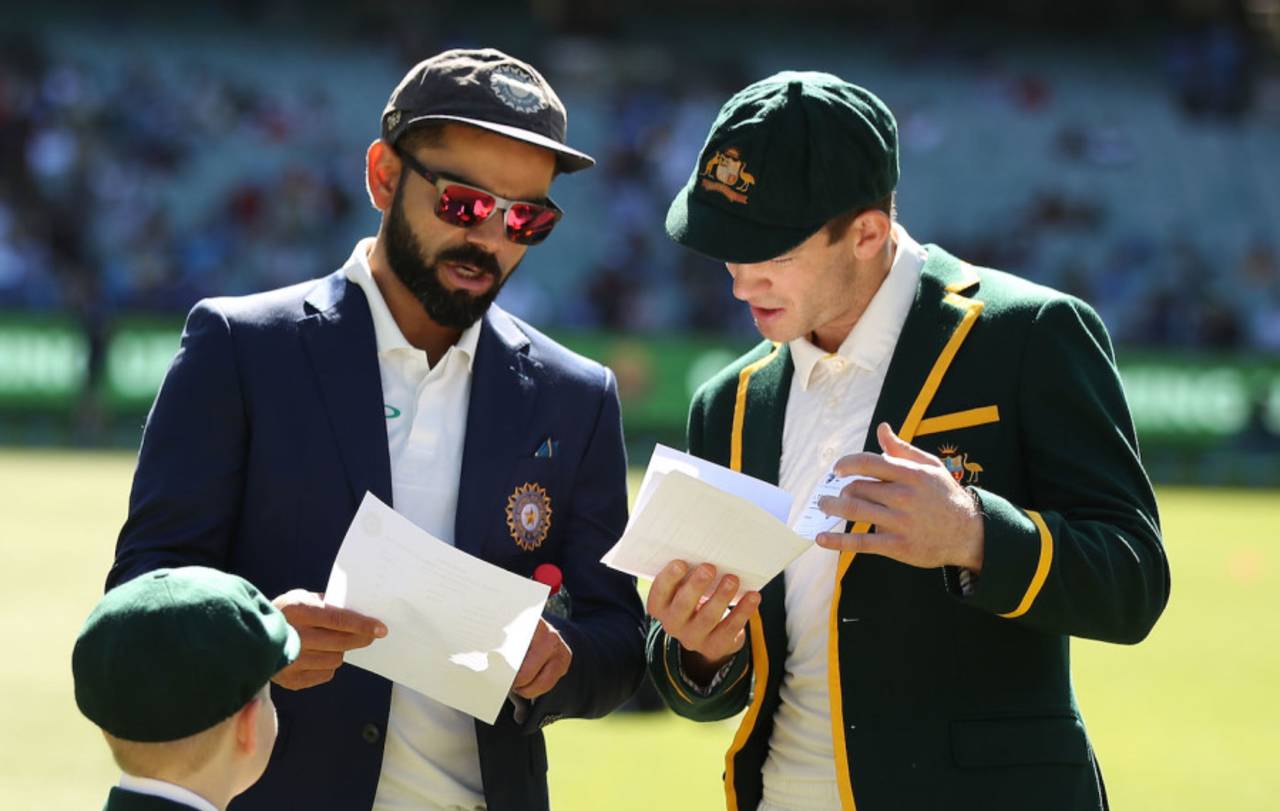 Virat Kohli and Tim Paine exchange team sheets before the coin toss, day one, third Test,  Australia v India, MCG, Melbourne, Australia, December 26, 2018 