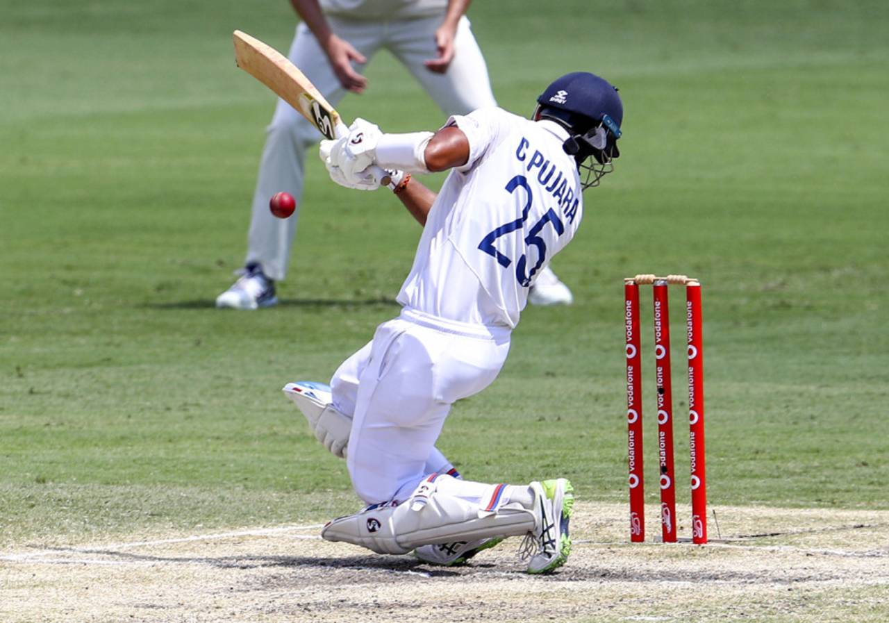 Cheteshwar Pujara reacts after getting hit on the helmet, Australia v India, 4thTest, Brisbane, 5th day, January 19, 2021