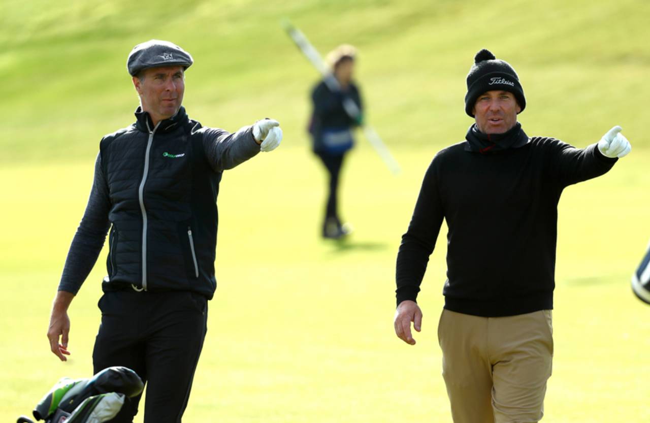 Michael Vaughan and Shane Warne play golf at the Alfred Dunhill Links Championship in St Andrews, September 28, 2019