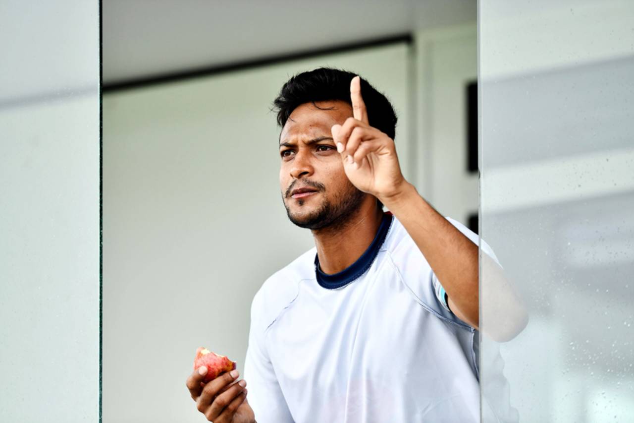 Shakib Al Hasan gestures from the dressing room during a training session in Taunton, June 16, 2019