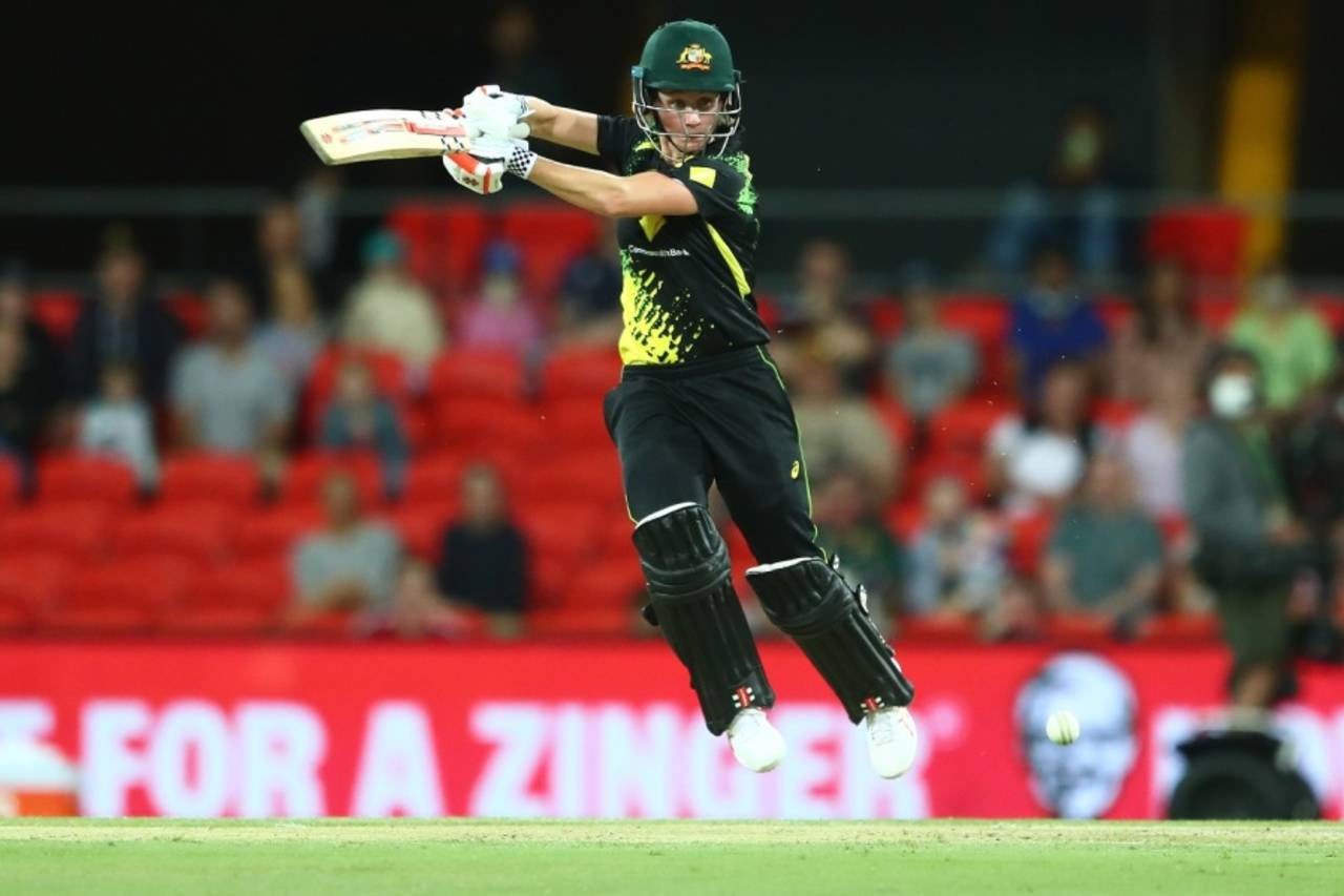 An airborne Beth Mooney hits one through the off side, Australia vs India, 3rd women's T20I, Carrara, October 10, 2021