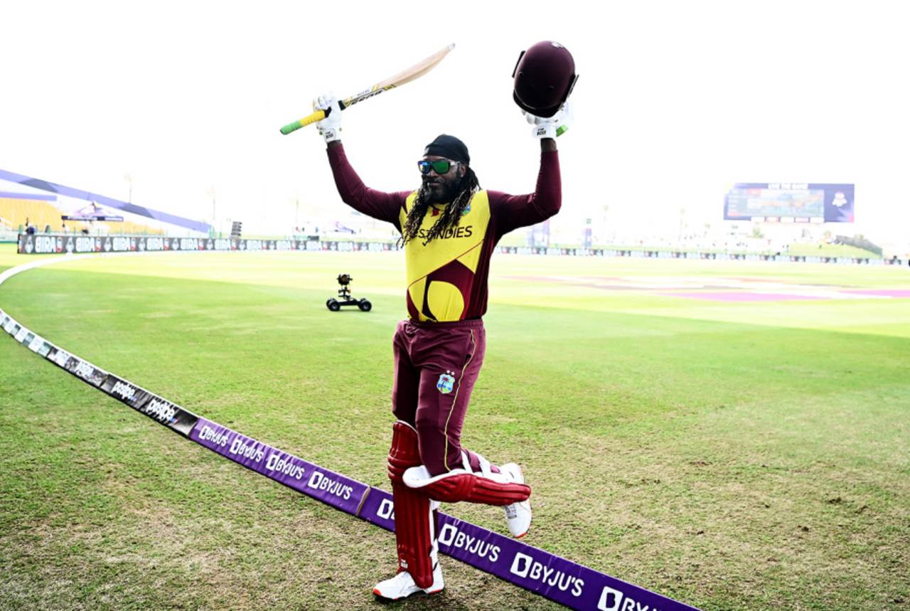 Chris Gayle raises his bat as he steps off the field, Australia vs West Indies, Men's T20 World Cup 2021, Super 12s, Abu Dhabi, November 6, 2021