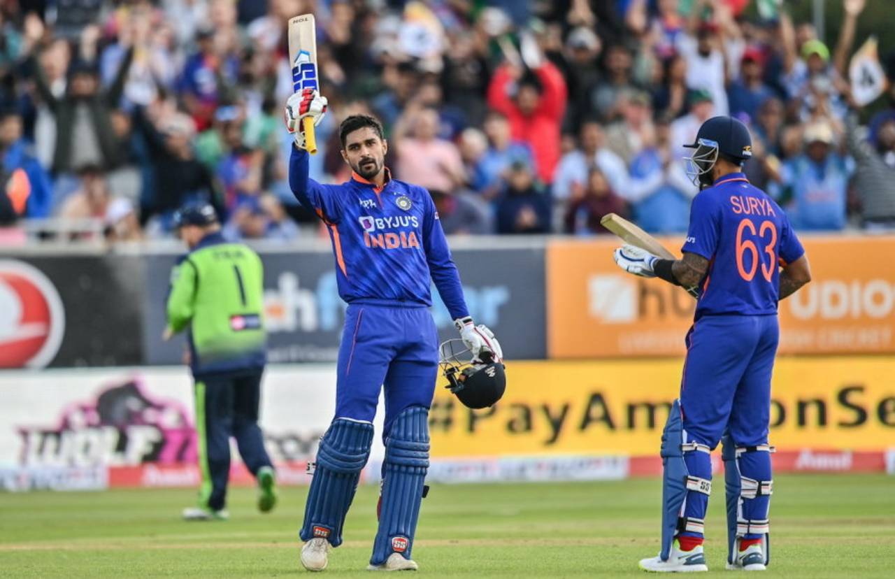 Deepak Hooda raises his bat after reaching his maiden T20I century&nbsp;&nbsp;&bull;&nbsp;&nbsp;Sportsfile/Getty Images
