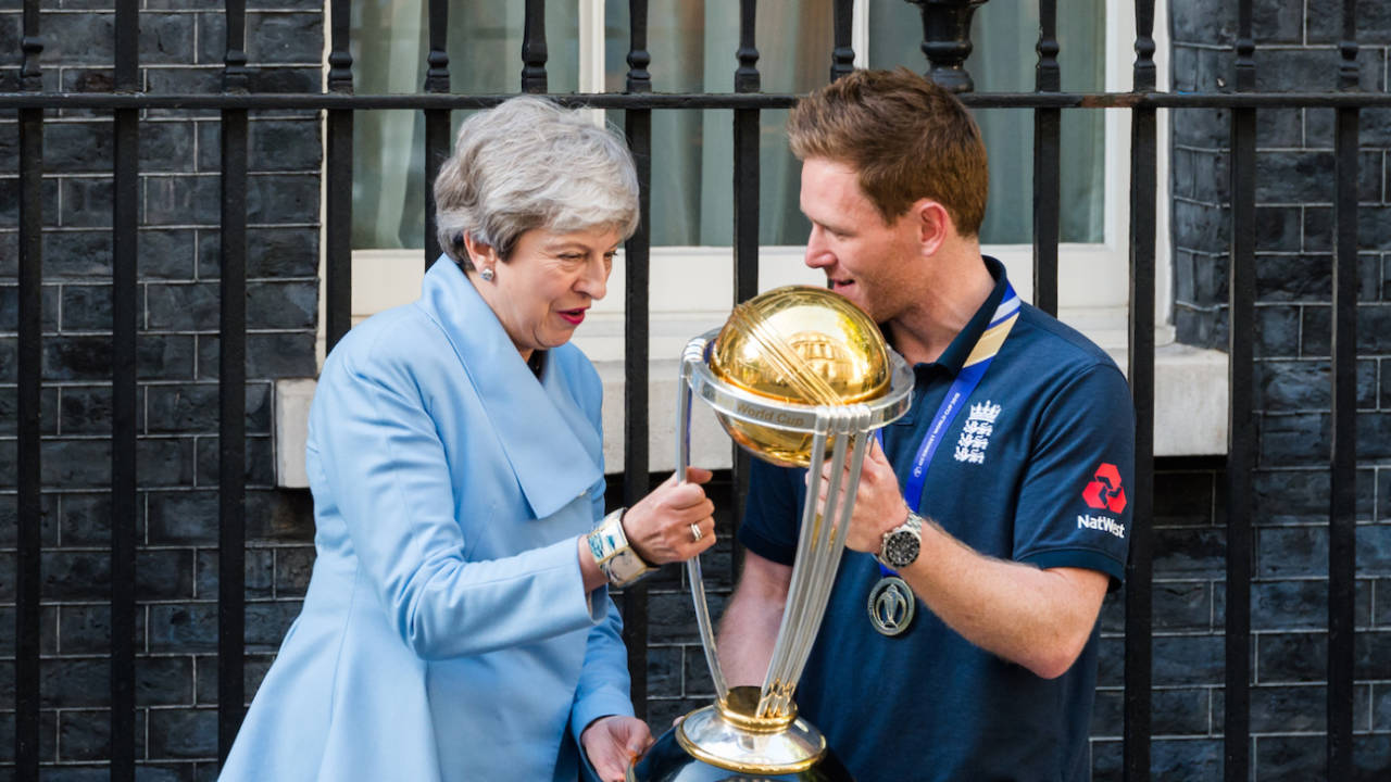 Eoin Morgan shows Prime Minister Theresa May the World Cup trophy outside 10 Downing Street, London, July 15, 2019