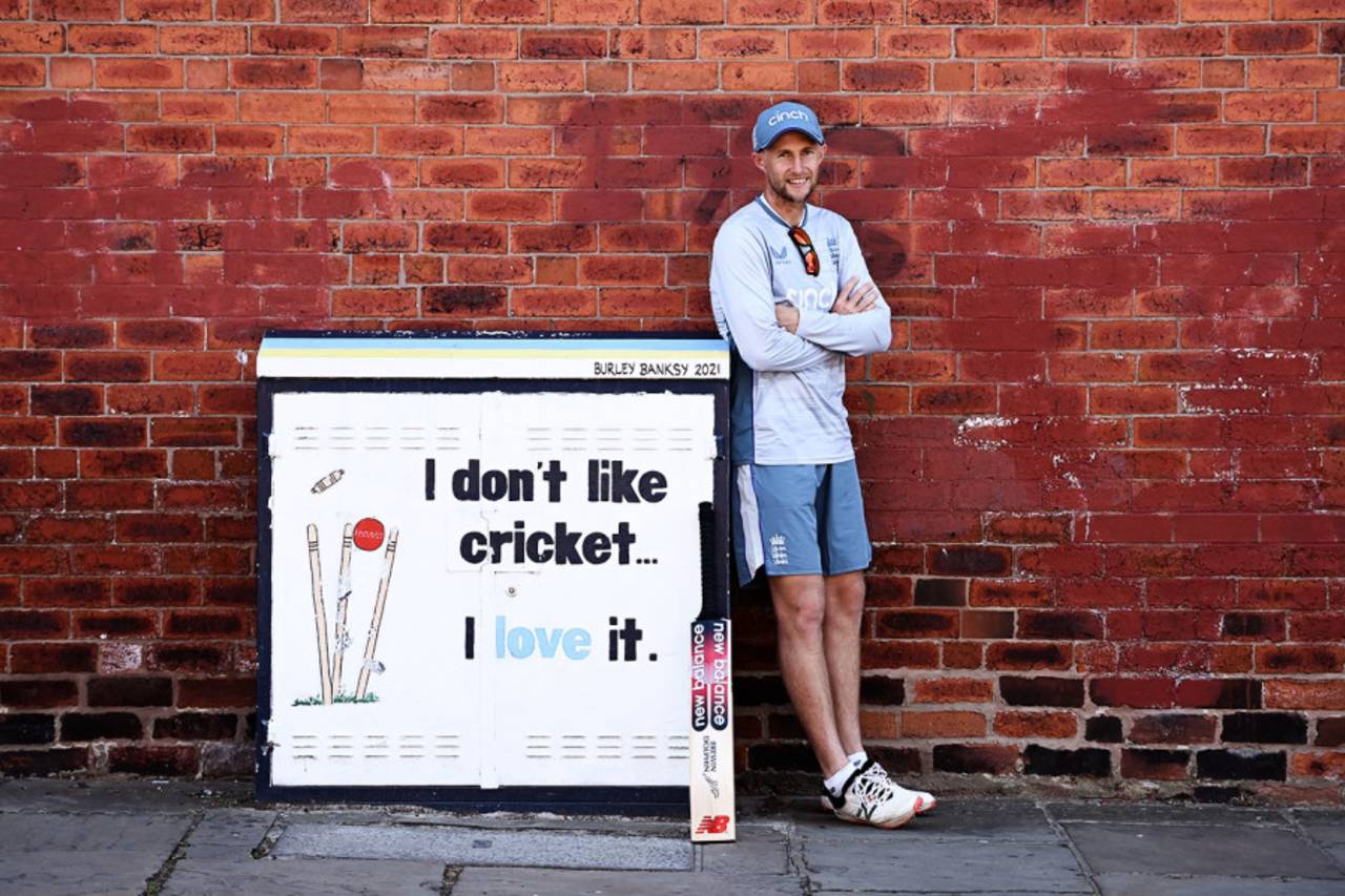 Joe Root stands next to a Burley Banksy painted telephone box that reads: "I don't like cricket... I love it", Headingley, June 22, 2022