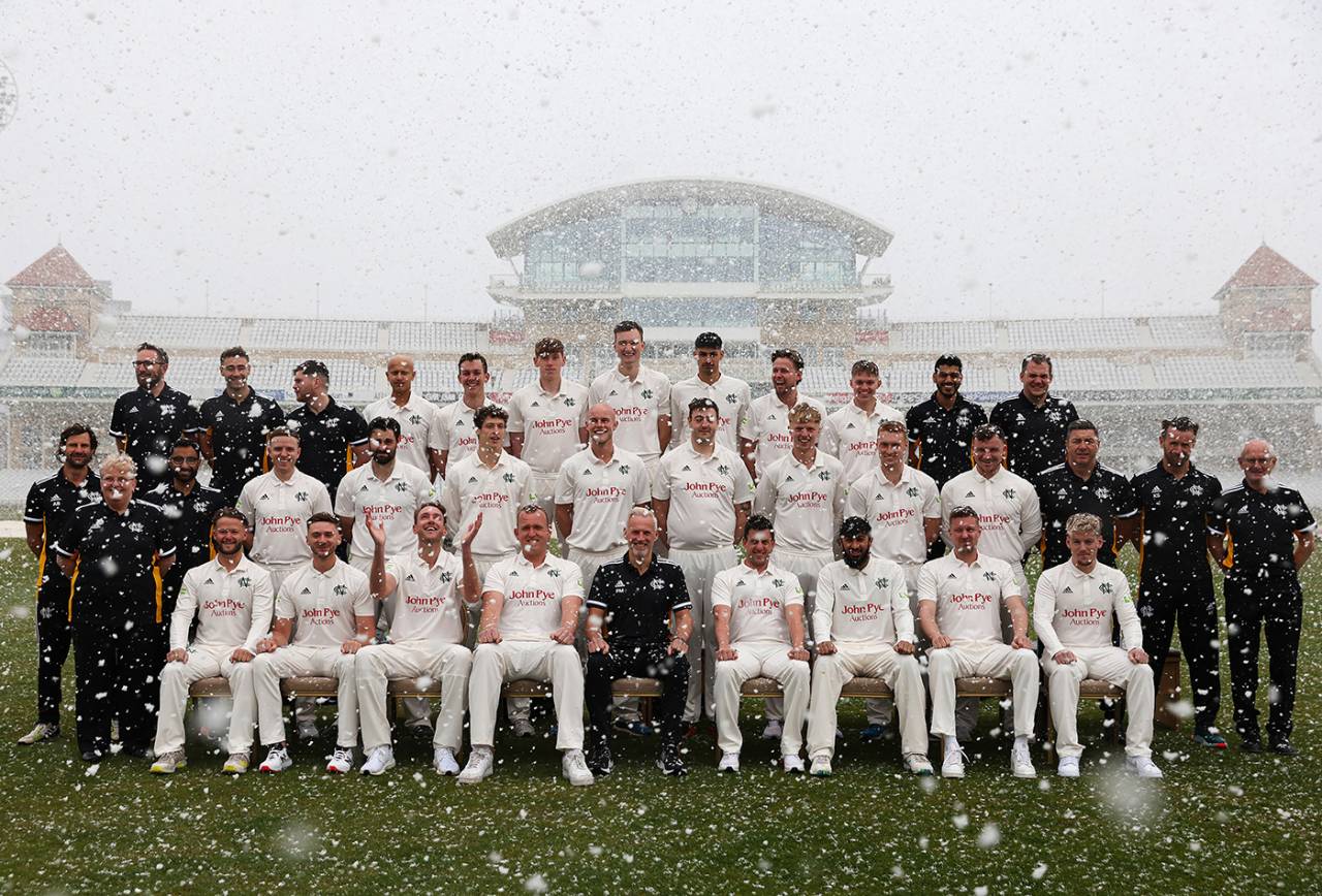 The winning image in the Wisden Cricket Photograph of the Year 2022 competition, Nottinghamshire players and coaching staff at their pre-season photocall during a snow flurry, Trent Bridge, March 31, 2022