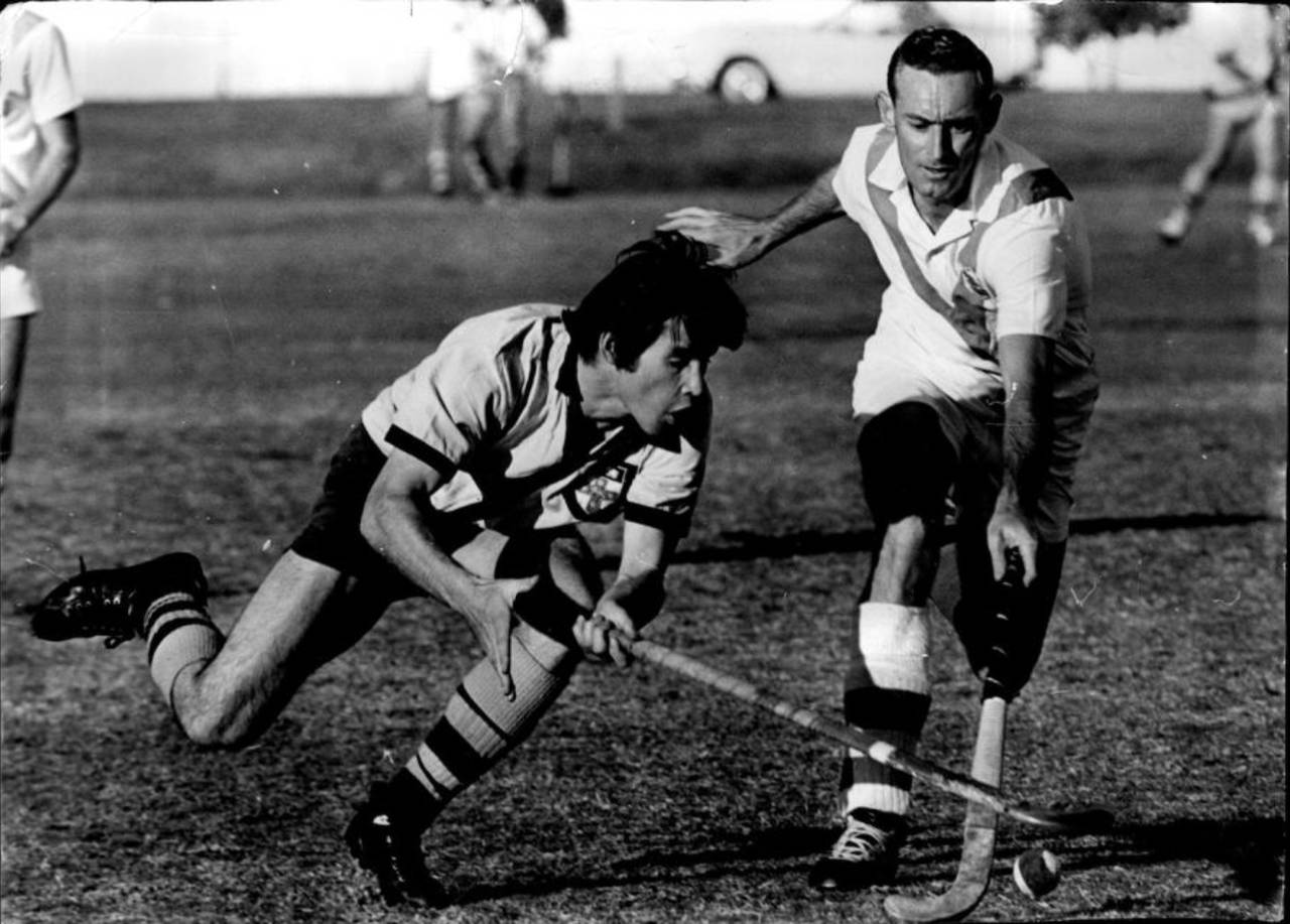 Brian Booth (right), seen here playing a local hockey match, is one of six Test cricketers to have represented their countries in the Olympics&nbsp;&nbsp;&bull;&nbsp;&nbsp;Fairfax Media/Getty Images
