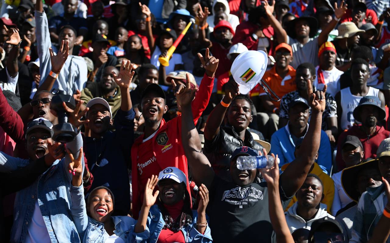 A joyful bunch: Zimbabwe fans celebrate their win