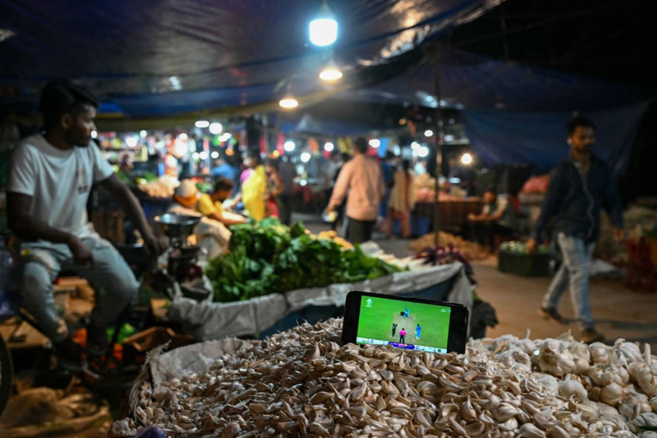 Feed my desire: the India-Pakistan World Cup game watched on a mobile phone in a vegetable market in Delhi&nbsp;&nbsp;&bull;&nbsp;&nbsp;Arun Sankar/AFP/Getty Images